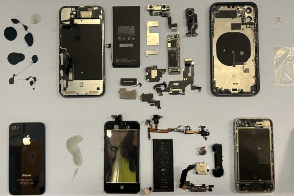 Smartphone components laid out showing large amount of plastic combined with other materials